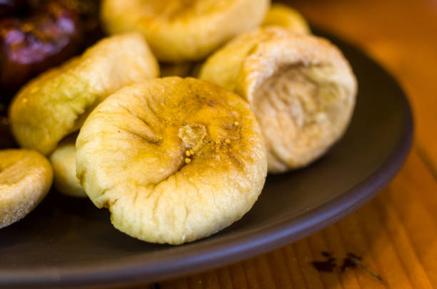 istock dried dates and figs in a ceramic plate on a wooden table 961353158