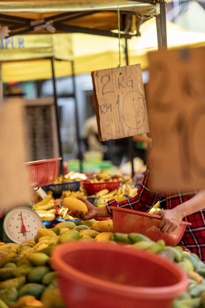 istock Buying fruit at a market in Malaysia 961354598