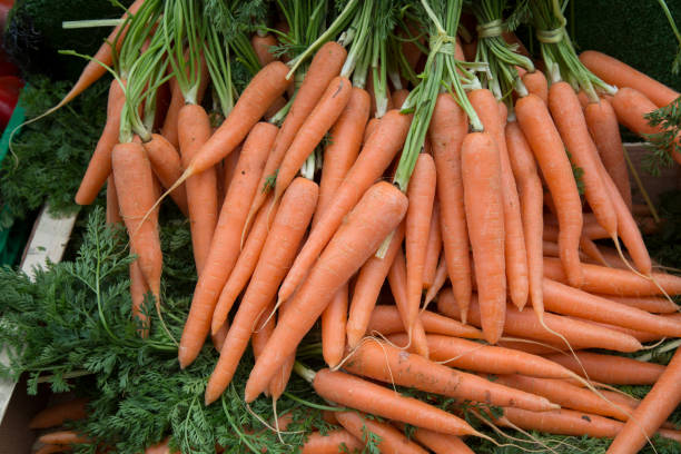 istock Carrot Background on Market 961356728