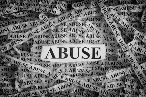istock Torn pieces of paper with the words Abuse 961360634