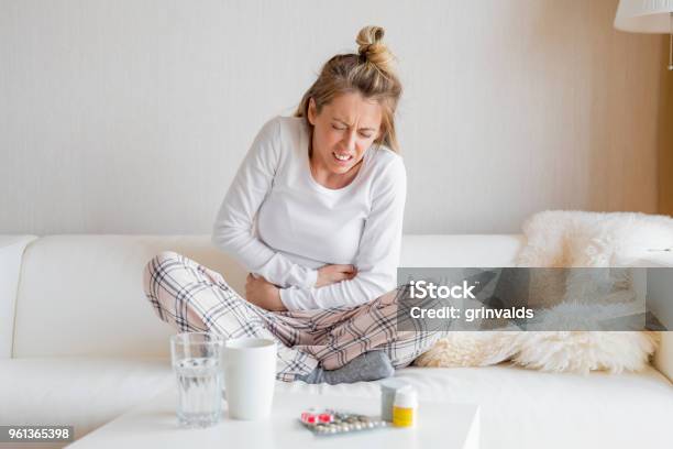 Woman Having Stomach Pain Stock Photo - Download Image Now - Abdomen, Adult, Adults Only
