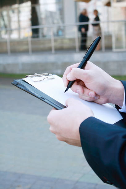 istock close up. businessman making notes on the clipboard 961365968