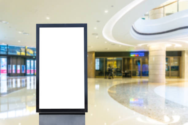 blank poster in shopping mall blank poster shopping mall stock pictures, royalty-free photos & images