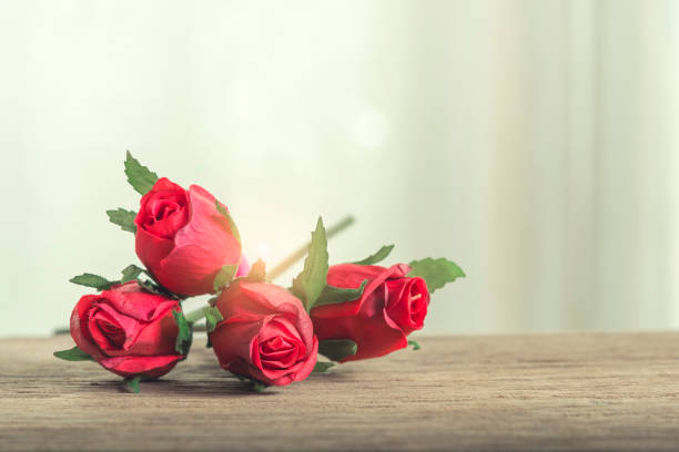 istock Wedding, love and valentine concept. Red roses on table with free space. 961371880