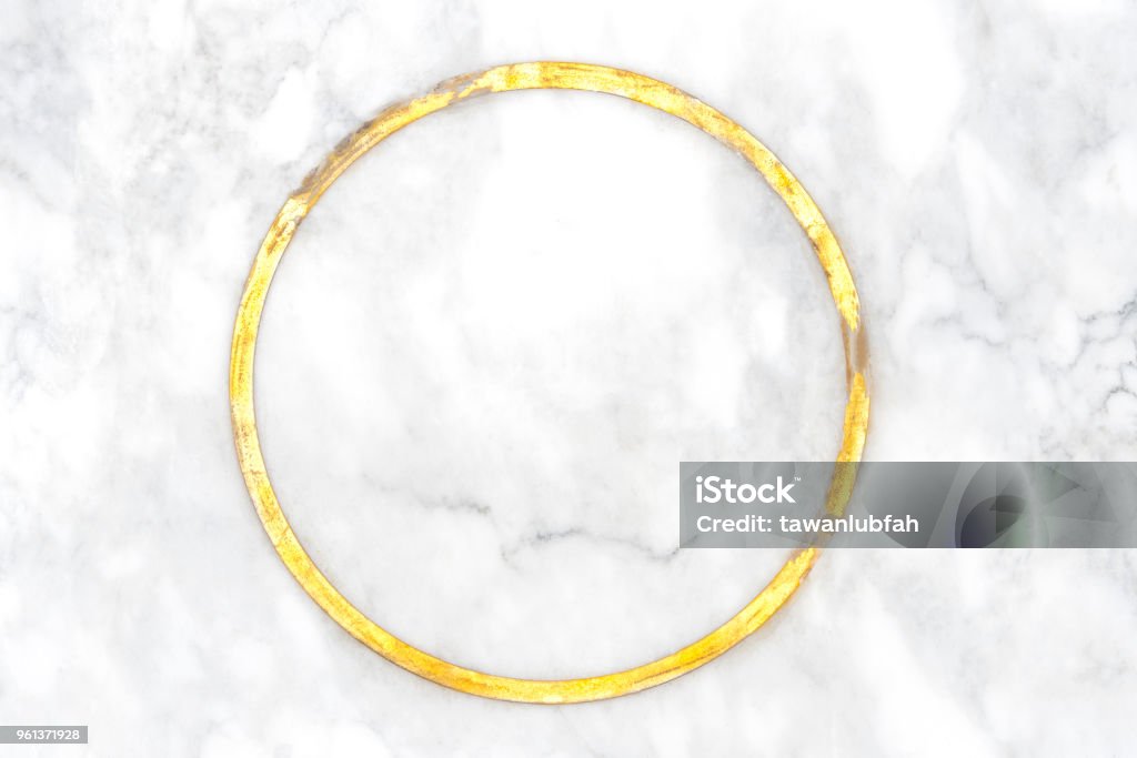 Abstract background from white marble texture with scratch. Abstract elegance background from natural white marble with golden ring on center. Luxury material for border and frame. Picture for add text message. Backdrop for design art work. Gold - Metal Stock Photo