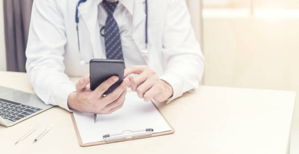 istock Doctor working and searching information on mobile at office. Treatment and technology concept. Picture for add text message. Backdrop for design art work. 961374602