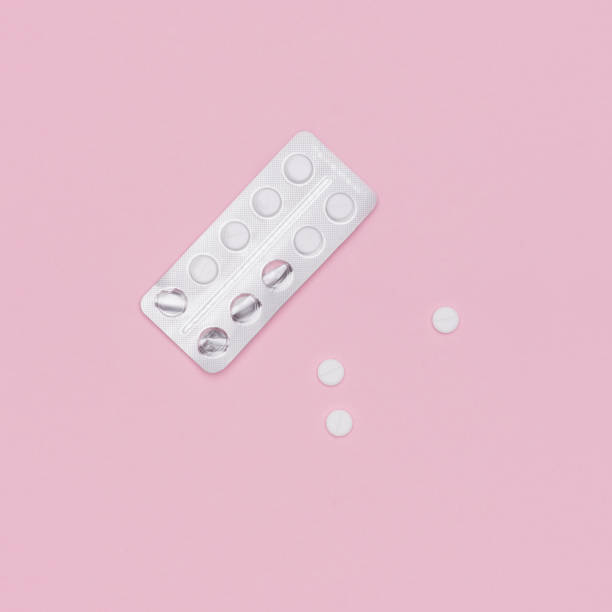 istock White pills and blister pack on pink pastel colored background. Pharmaceutical industry minimal still life flat lay background. Opioid epidemic and drug abuse concept. 961374688