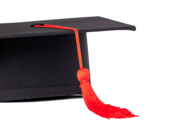 istock Graduation cap with red tassel isolated on white background 961381282