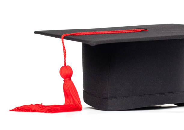 istock Graduation cap with red tassel isolated on white background 961381286