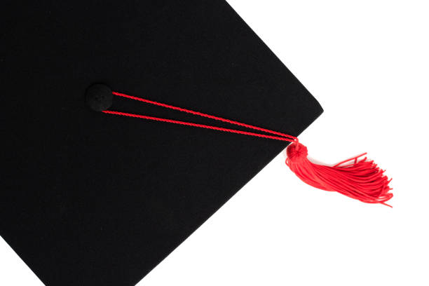istock Graduation cap with red tassel isolated on white background 961381298
