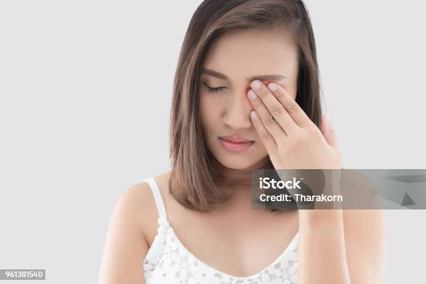 Woman Has A Pain In The Eye Stock Photo - Download Image Now - Eye, Pain, Swollen