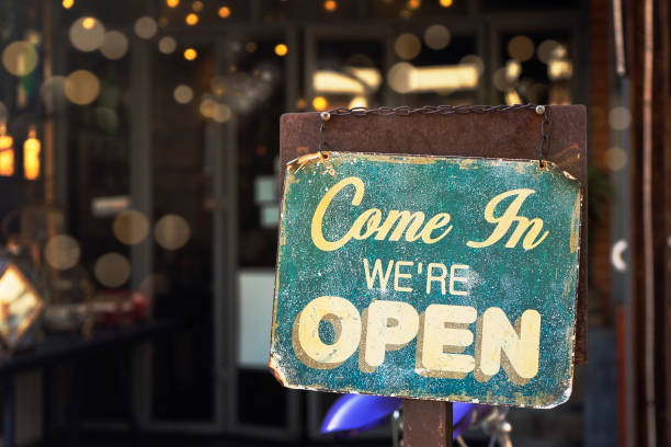 istock open sign hanging outside a restaurant, store, office or other 961384350