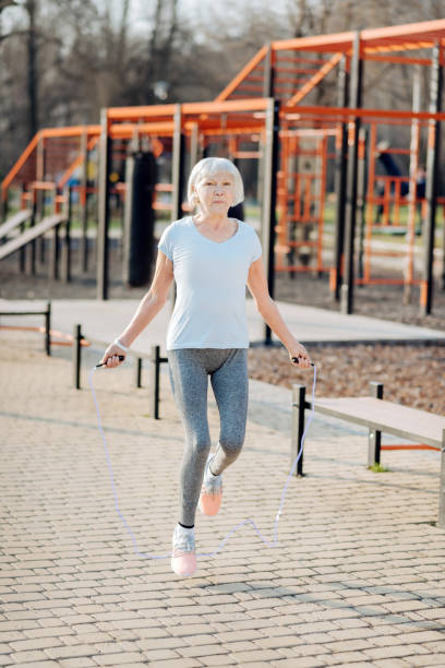 istock Inspired aged woman jumping her rope 961400302