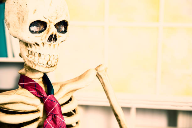istock Skeleton businessman worked to death in office. 961404250