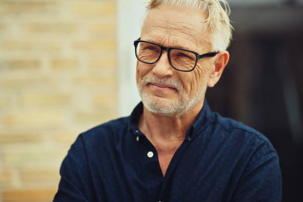 istock Smiling senior man standing outside in his yard 961408822