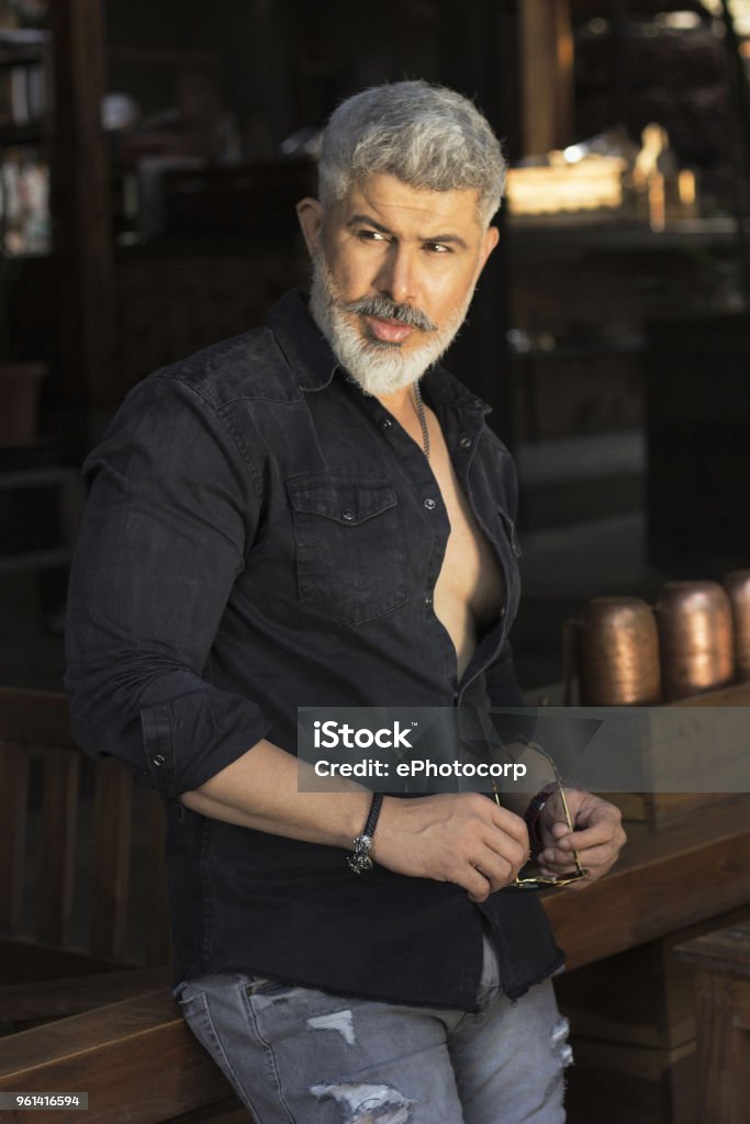 Man With White Hair And Beard In Black Shirt Looking Sideways Stock Photo - Download Image Now - iStock Man With White Hair And Beard In Black Shirt Looking Sideways Stock Photo - Download Image Now - iStock