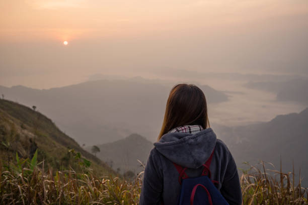 istock Young woman traveler looking at sunrise 961420488