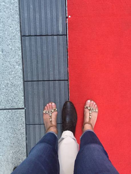 istock Low Section Of People Standing On Red Floor 961421570