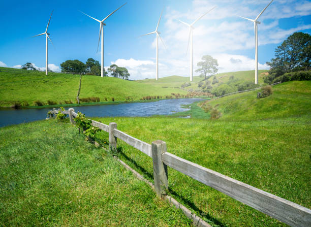istock Wind turbines farm on a green grass hills. 961427142