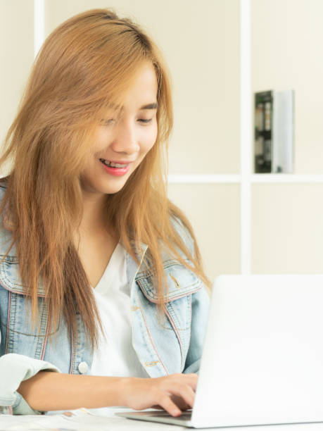 istock Happy woman works on computer in home office. 961427818