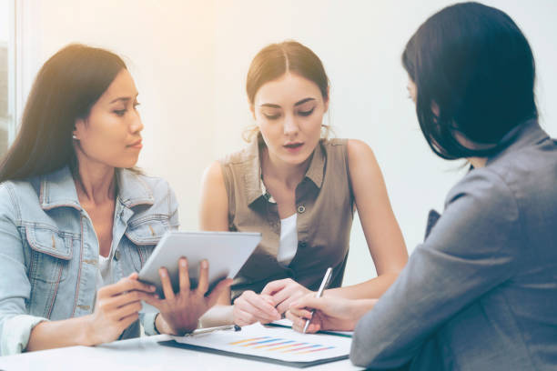istock Multicultural businesswomen in group meeting. 961428122