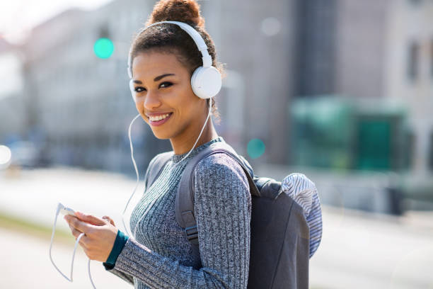 istock Young woman wearing headphones 961428168