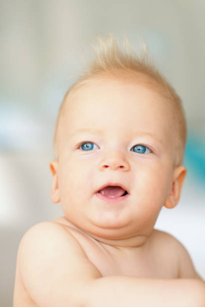 istock Baby boy with blue eyes 961434818