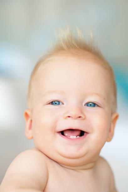 istock Baby boy with blue eyes 961434842
