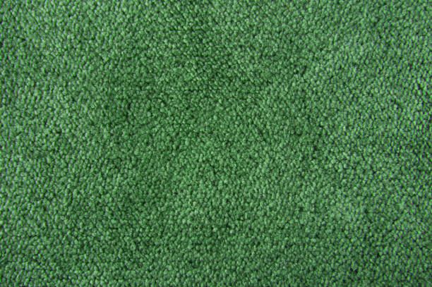 istock Fabric texture green carpeting for background 961435554