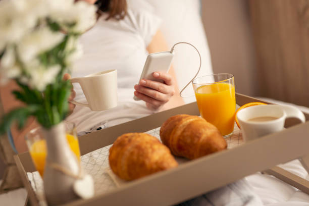 istock Woman drinking coffee in bed 961436910