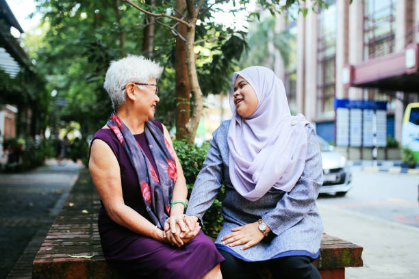 istock Two Malaysian women talking 961442738
