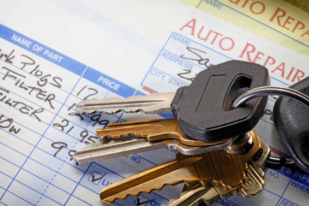 istock Key Ring Sitting On Top Of Auto Repair Bill 961442742