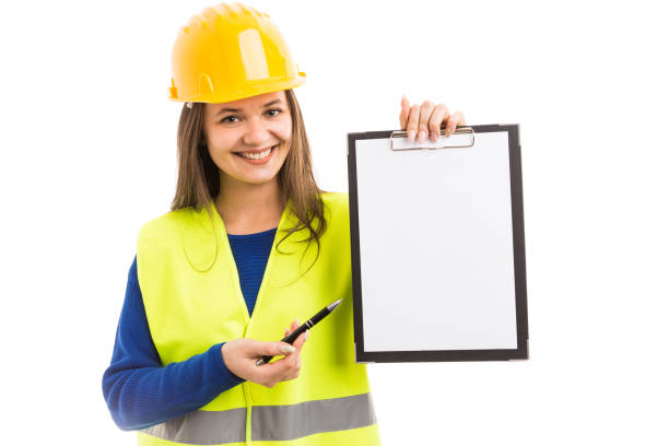 istock Young woman architect holding blank clipboard 961446180