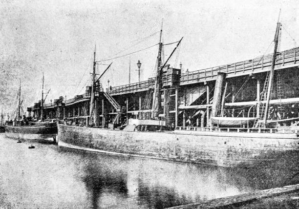 Coating Jetty with large boat in docks