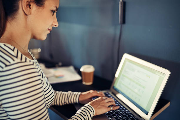 istock Young designer working on a laptop in an office 961448114