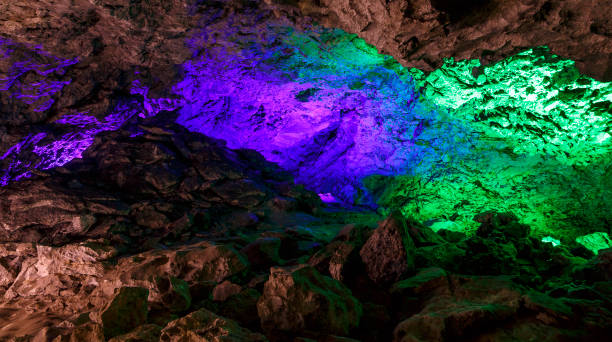 istock beautiful illuminated multicolored stalactites grotto with icicles 961449196