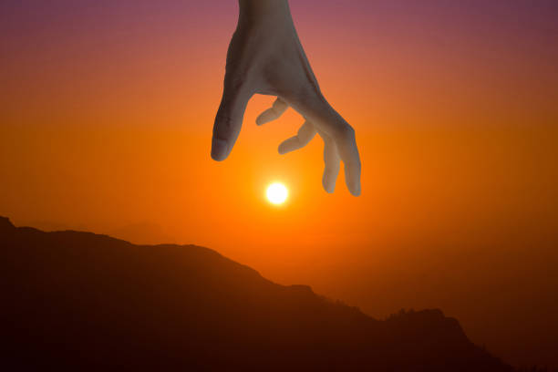 istock Hand catching the golden sun 961451334