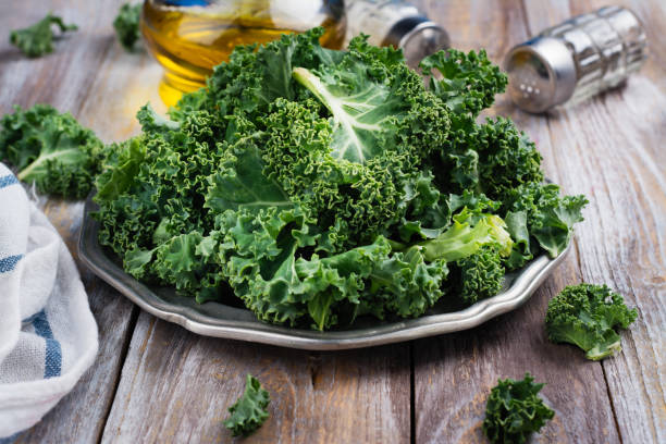 istock Green kale leaves on plate 961457918