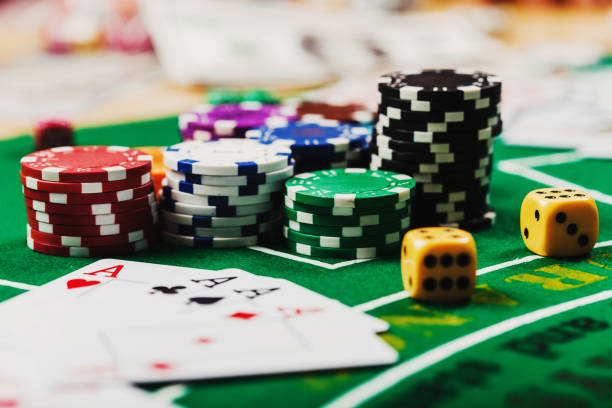 Poker chips on table in casino. Cards on green felt casino table Poker chips on table in casino. Cards on green felt casino table texas hold em photos stock pictures, royalty-free photos & images