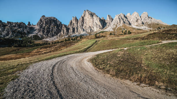 Dirt Road and Hiking Trail Track in Dolomite Italy Dirt road and hiking trail track in Dolomites mountain, Italy, in front of Pizes de Cir Ridge mountain ranges in Bolzano, South Tyrol, Northwestern Dolomites, Italy. 1354 stock pictures, royalty-free photos & images
