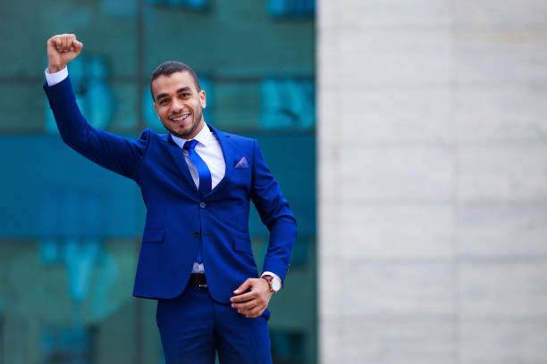 istock Excited young businessman expressing positivity standing outdoor 961466834
