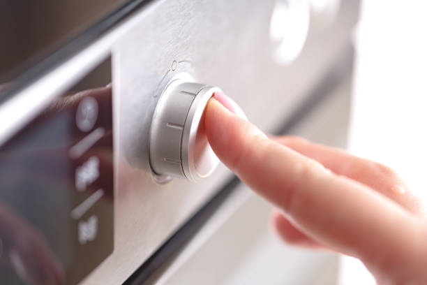istock Detail of female hand while using the microwave 961466960
