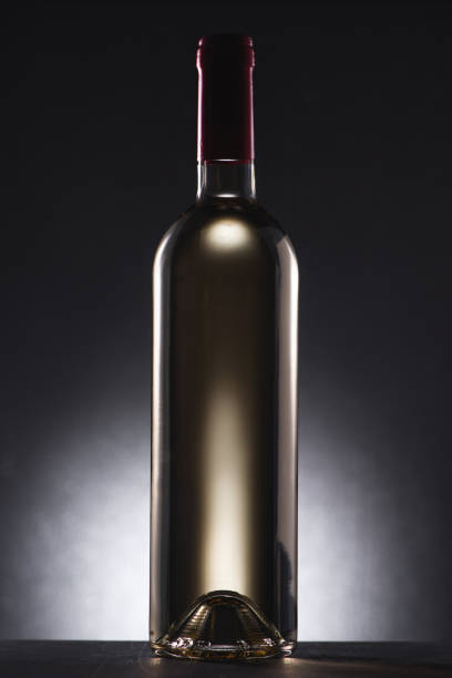 Bottle of red wine on black background.