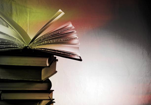 istock stack of old books in gray, red and yellow tones, Copyspace for your text 961467746
