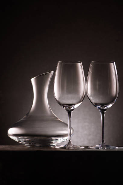 istock still life of empty decanter and wineglasses on black 961471110