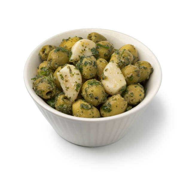 istock Bowl with green olives, garlic and cilantro 961477300