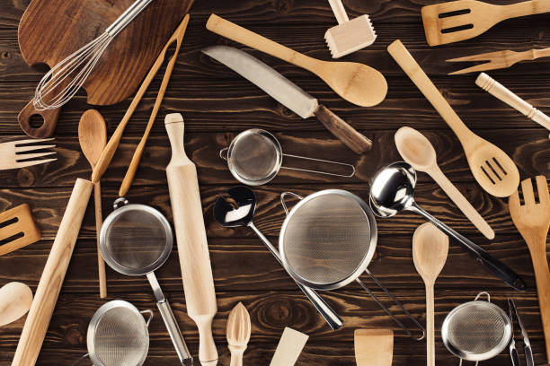 istock elevated view of different kitchen utensils on wooden table 961482010