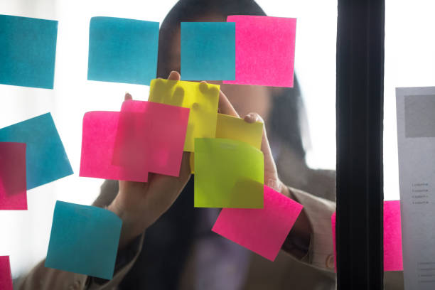 istock Businesswoman putting her ideas on glass. 961484796