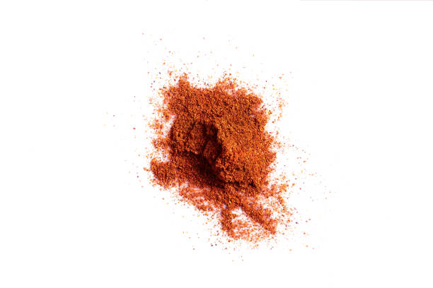 istock Crushed red pepper chilli pile from top on white background 961490440
