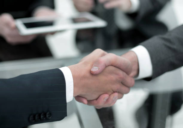 istock Close up of businessmen shaking hands 961492972
